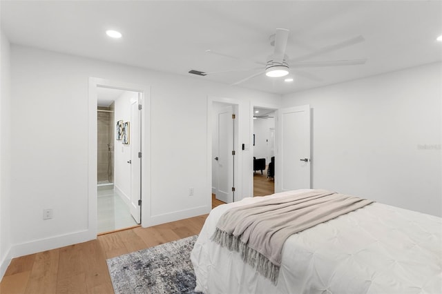 11772 96th Pl, Seminole, FL 33772 - bedroom with light wood-style flooring, recessed lighting, connected bathroom, and a ceiling fan