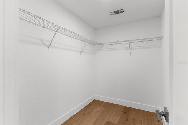 11772 96th Pl, Seminole, FL 33772 - walk in closet featuring wood finished floors