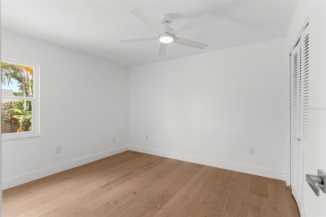 11772 96th Pl, Seminole, FL 33772 - unfurnished bedroom with light wood finished floors and a ceiling fan