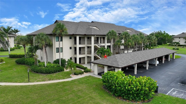 3 Pirates Ln Unit 32A, Punta Gorda, FL 33955 - view of building exterior with covered and uncovered parking