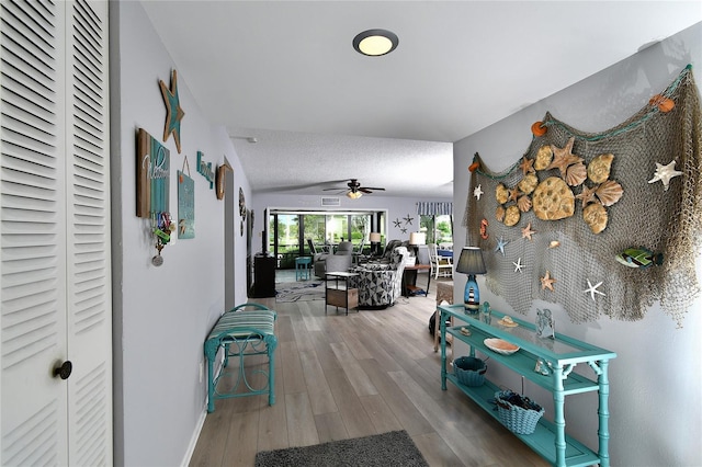 3 Pirates Ln Unit 32A, Punta Gorda, FL 33955 - hallway with wood finished floors and a textured ceiling