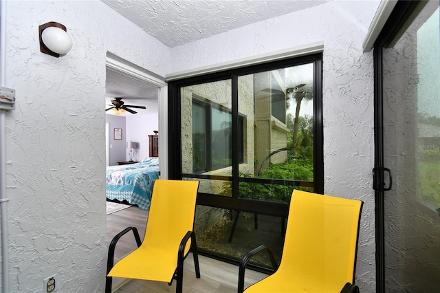 3 Pirates Ln Unit 32A, Punta Gorda, FL 33955 - interior space featuring a textured wall, a ceiling fan, a textured ceiling, and wood finished floors
