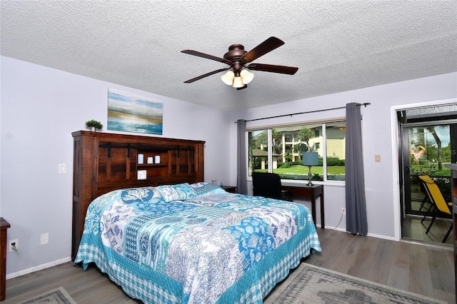 3 Pirates Ln Unit 32A, Punta Gorda, FL 33955 - bedroom featuring wood finished floors, access to outside, a textured ceiling, and a ceiling fan