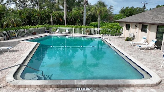 3 Pirates Ln Unit 32A, Punta Gorda, FL 33955 - community pool featuring a patio and view of wooded area