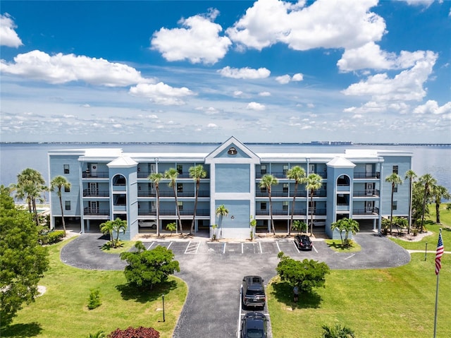 1750 Jamaica Way Unit 131, Punta Gorda, FL 33950 - view of apartment building / complex featuring uncovered parking and a water view