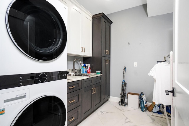 1750 Jamaica Way Unit 131, Punta Gorda, FL 33950 - washroom featuring cabinet space, stacked washer and clothes dryer, and light marble finish flooring