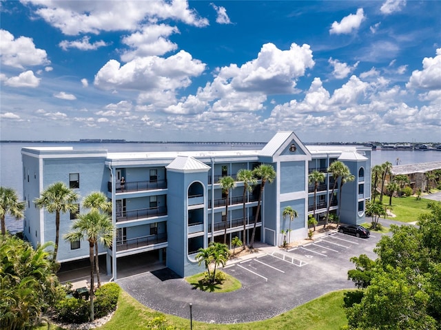 1750 Jamaica Way Unit 131, Punta Gorda, FL 33950 - view of apartment building / complex featuring uncovered parking and a water view