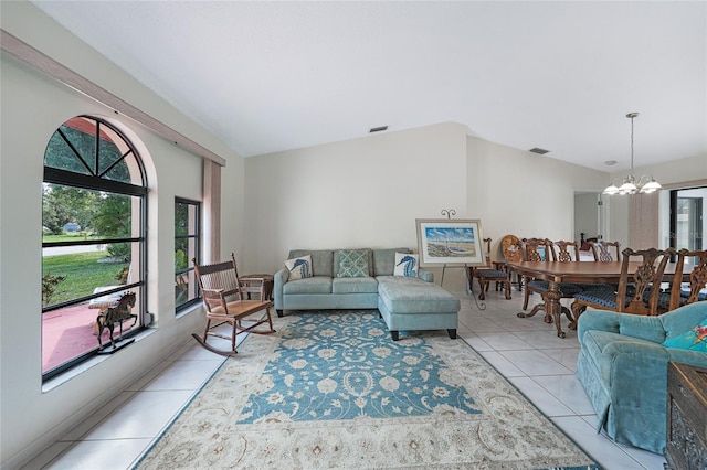 25499 Taltal Dr, Punta Gorda, FL 33983 - living area featuring light tile patterned flooring, healthy amount of natural light, a chandelier, and vaulted ceiling
