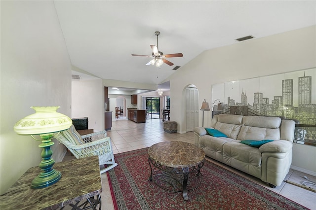 25499 Taltal Dr, Punta Gorda, FL 33983 - living area featuring vaulted ceiling, ceiling fan, and tile patterned floors