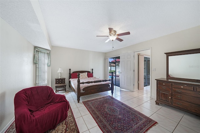 25499 Taltal Dr, Punta Gorda, FL 33983 - bedroom featuring a textured ceiling, light tile patterned floors, and a ceiling fan