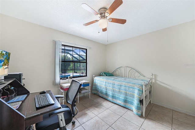 25499 Taltal Dr, Punta Gorda, FL 33983 - bedroom featuring a desk, a textured ceiling, tile patterned flooring, and ceiling fan