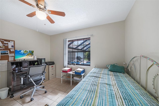 25499 Taltal Dr, Punta Gorda, FL 33983 - tiled bedroom with a textured ceiling, a ceiling fan, and a desk