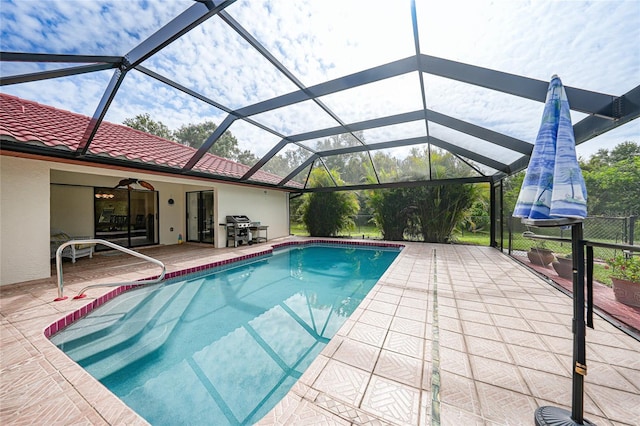 25499 Taltal Dr, Punta Gorda, FL 33983 - outdoor pool featuring a grill, a patio area, a lanai, and a ceiling fan