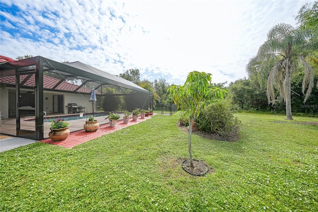 25499 Taltal Dr, Punta Gorda, FL 33983 - view of grassy yard featuring a patio area, an outdoor pool, and glass enclosure