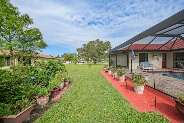 25499 Taltal Dr, Punta Gorda, FL 33983 - view of green lawn with a patio area, a lanai, and an outdoor pool