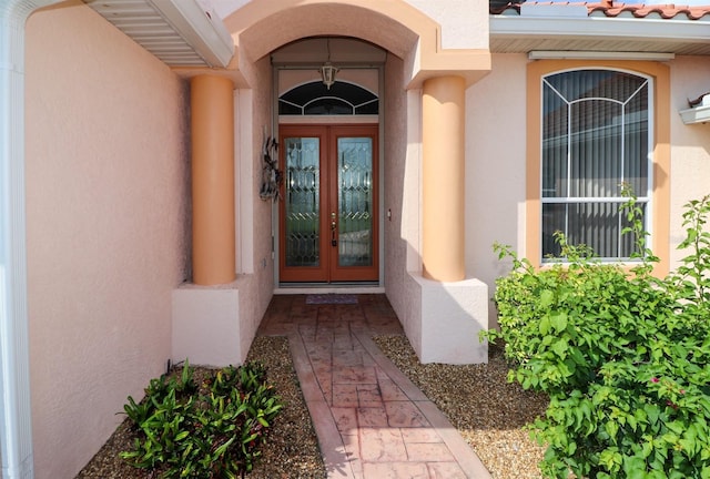 1855 Silver Palm Rd, North Port, FL 34288 - property entrance with stucco siding and french doors