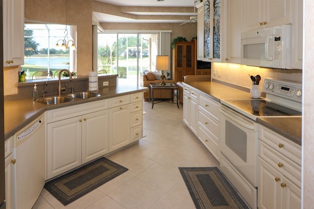 1855 Silver Palm Rd, North Port, FL 34288 - kitchen with white appliances, backsplash, light tile patterned floors, and a ceiling fan