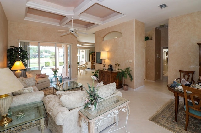 1855 Silver Palm Rd, North Port, FL 34288 - living room featuring a ceiling fan, coffered ceiling, light tile patterned floors, a high ceiling, and beamed ceiling
