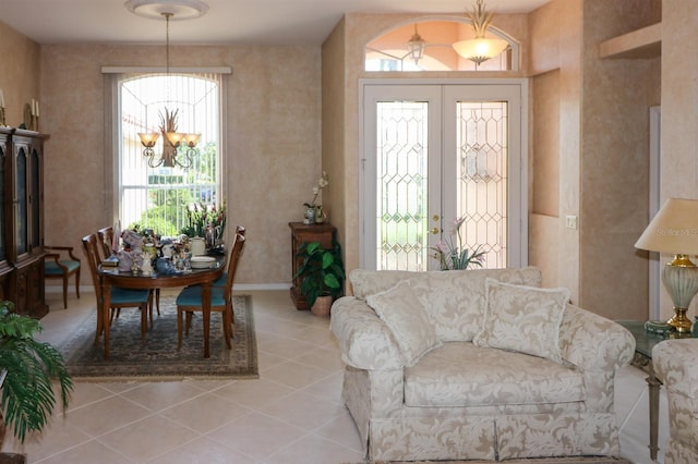 1855 Silver Palm Rd, North Port, FL 34288 - living room featuring a chandelier, french doors, and light tile patterned floors