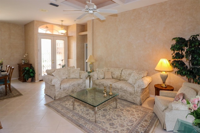 1855 Silver Palm Rd, North Port, FL 34288 - living area featuring coffered ceiling, french doors, tile patterned flooring, ceiling fan, and beam ceiling