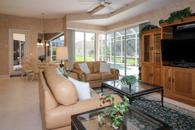 1855 Silver Palm Rd, North Port, FL 34288 - living room featuring light tile patterned flooring, ceiling fan, and a chandelier