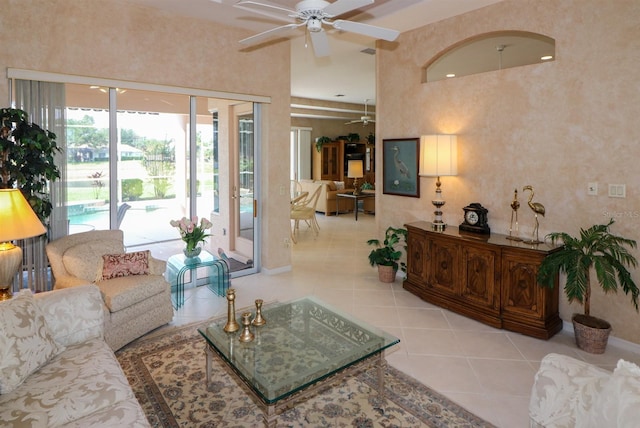 1855 Silver Palm Rd, North Port, FL 34288 - living room with ceiling fan, tile patterned flooring, and a high ceiling