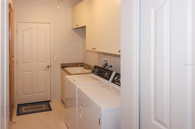 1855 Silver Palm Rd, North Port, FL 34288 - laundry area with washing machine and clothes dryer, cabinet space, and light tile patterned flooring