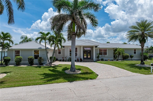 1422 Via Milanese, Punta Gorda, FL 33950 - single story home featuring french doors, decorative driveway, a tile roof, and a front lawn