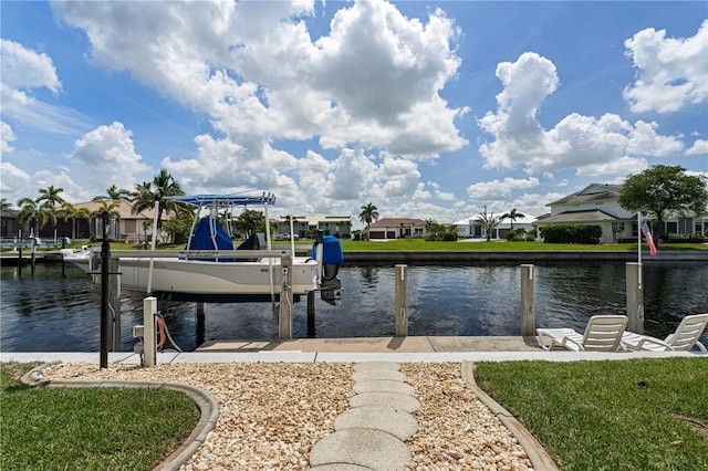 1422 Via Milanese, Punta Gorda, FL 33950 - dock featuring boat lift, a water view, and a residential view