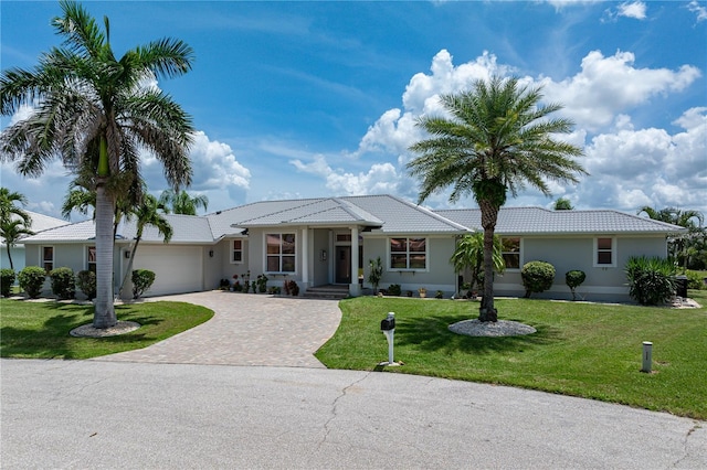1422 Via Milanese, Punta Gorda, FL 33950 - single story home featuring driveway, an attached garage, a front yard, and stucco siding