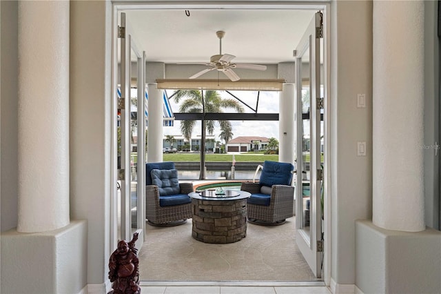 1422 Via Milanese, Punta Gorda, FL 33950 - sitting room with a ceiling fan, tile patterned floors, and a water view