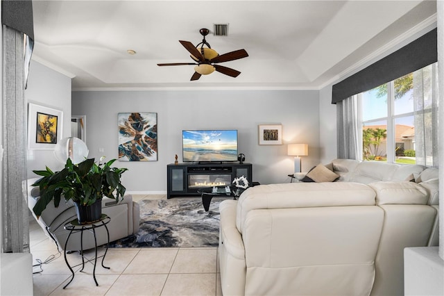1422 Via Milanese, Punta Gorda, FL 33950 - living room featuring a tray ceiling, tile patterned flooring, ceiling fan, and ornamental molding