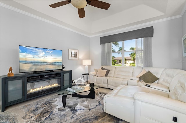 1422 Via Milanese, Punta Gorda, FL 33950 - living room with ceiling fan, a raised ceiling, ornamental molding, and a glass covered fireplace