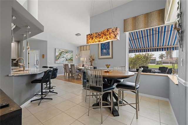 1422 Via Milanese, Punta Gorda, FL 33950 - dining area with light tile patterned floors and a high ceiling