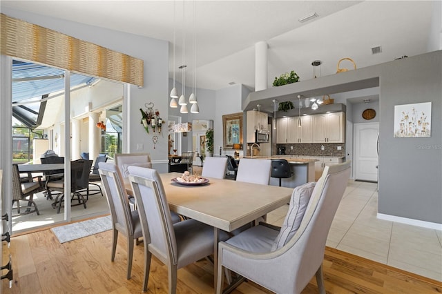 1422 Via Milanese, Punta Gorda, FL 33950 - dining room with high vaulted ceiling and light wood-style floors