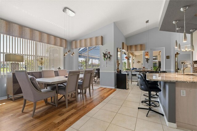 1422 Via Milanese, Punta Gorda, FL 33950 - dining room with light wood-style flooring and high vaulted ceiling