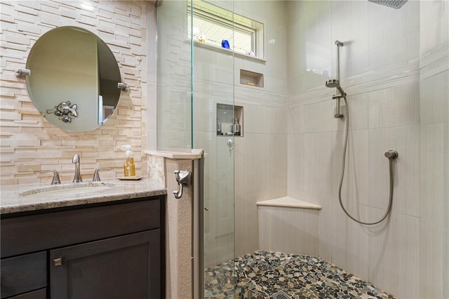 1422 Via Milanese, Punta Gorda, FL 33950 - bathroom featuring a shower stall, vanity, and backsplash