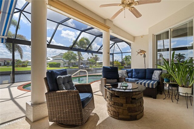 1422 Via Milanese, Punta Gorda, FL 33950 - view of patio featuring an outdoor living space with a fire pit, a ceiling fan, an outdoor pool, a lanai, and a water view