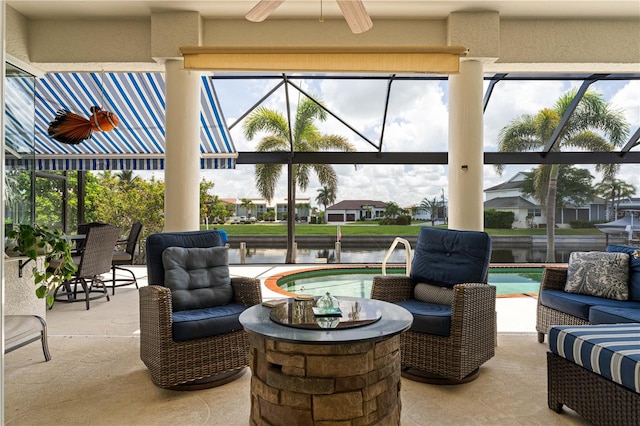 1422 Via Milanese, Punta Gorda, FL 33950 - view of patio featuring a water view, glass enclosure, an outdoor pool, and a ceiling fan