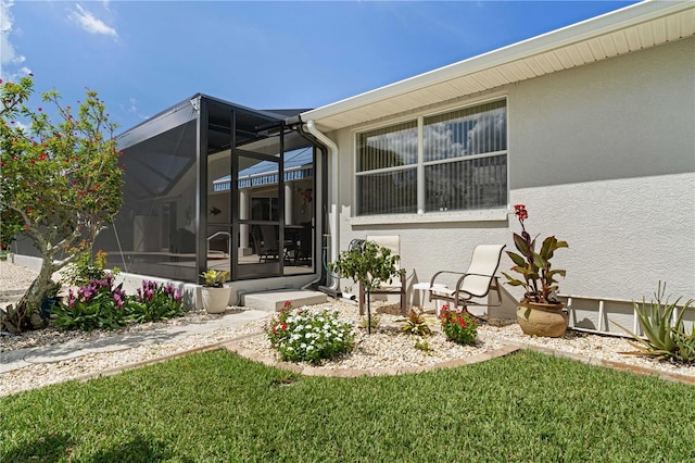 1422 Via Milanese, Punta Gorda, FL 33950 - rear view of house featuring stucco siding, a lanai, and a lawn
