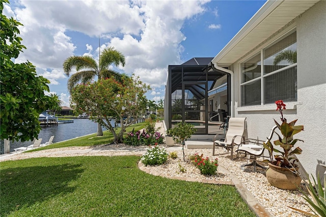 1422 Via Milanese, Punta Gorda, FL 33950 - view of green lawn with a water view, a patio area, and glass enclosure