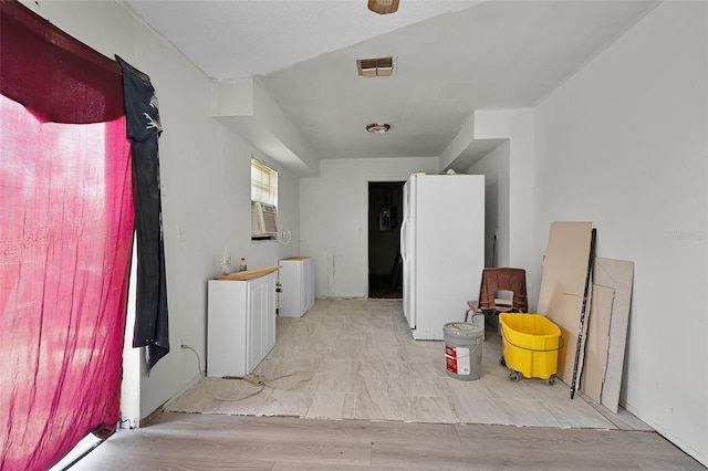 3207 Chariot Pl, Orlando, FL 32818 - laundry room featuring cooling unit and light wood-style flooring