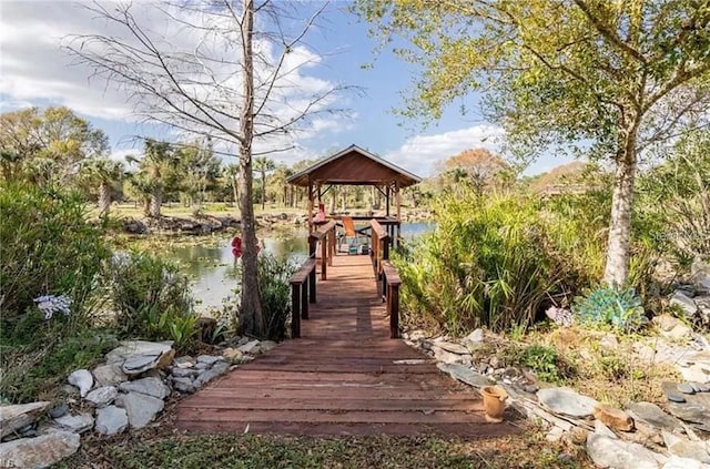 dock area with a gazebo and a water view