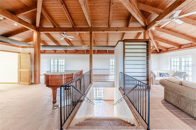 stairs featuring tile patterned floors, wood ceiling, and ceiling fan