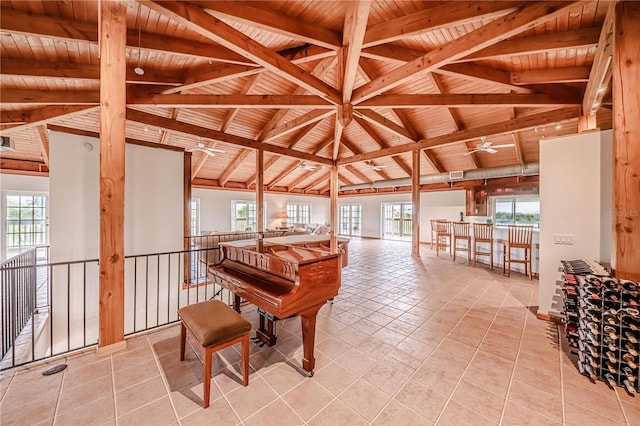 misc room featuring light tile patterned flooring, wooden ceiling, and vaulted ceiling with beams