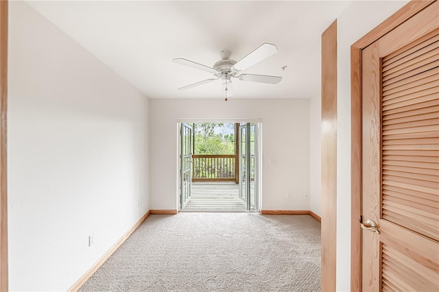 interior space with carpet and ceiling fan