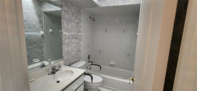 full bathroom with tiled shower / bath combo, vanity, and toilet