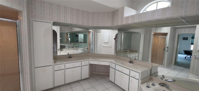 bathroom featuring tile patterned floors, plus walk in shower, and vanity