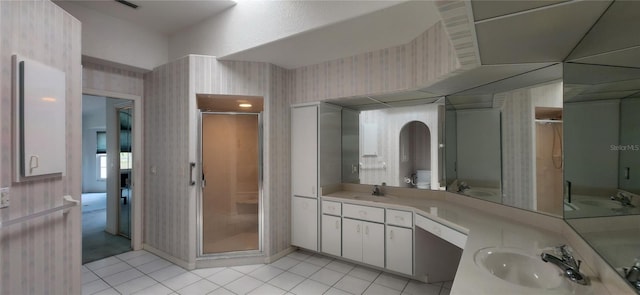 bathroom featuring vanity, an enclosed shower, and tile patterned flooring