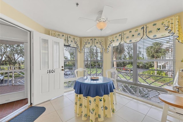 sunroom / solarium with ceiling fan and a wealth of natural light